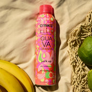 Amika x Ellis Brooklyn GUAVA GRANITA Perk Up Dry Shampoo on tan fabric next to bananas, guavas, and tan woven bag