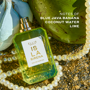 ISLA SIRENA Eau de Parfum 50ml without cap lays on top of a white string of pearls, and against a bunch of blue bananas and a green coconut with white text that reads "Notes of blue java banana, coconut water, lime" all on top of a brown, wet rock