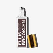 Milk Wood Fragrance Oil 15ml with cap removed on white background.
