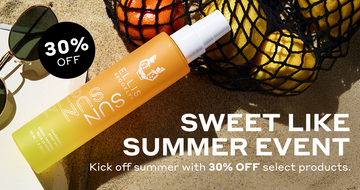 Sun Hair and Body Fragrance Mist 100ml in sand leaning on black mesh bag filled with oranges and lemons, and corner of open book, next to sunglasses, next tot black circle with white text that reads "30% OFF" and white text on sand that reads "Sweet Like Summer Event Kick off Summer with 30% off select products."